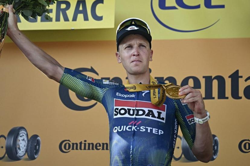 Soudal Quick-Step team's Belgian rider Tim Merlier celebrates on the podium after winning the 8th stage of the 113th edition of the Tour de France cycling race, 182 km between Périgueux and Bergerac in southwestern France, on July 11, 2026.  Loic VENANCE / AFP