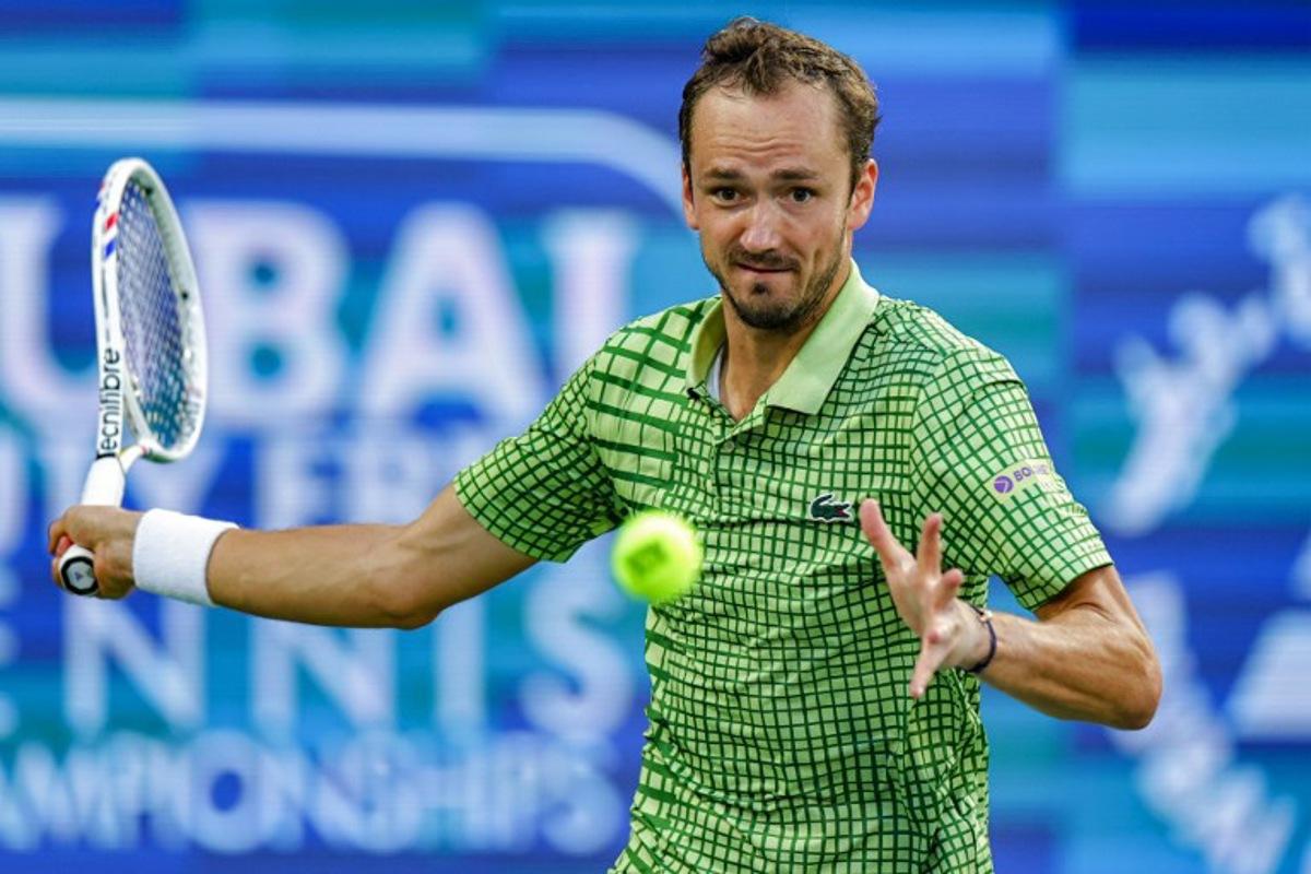 Russia's Daniil Medvedev returns a shot during his men's singles semi-final match against Canada's Felix Auger-Aliassime at the Dubai Duty Free Tennis tournament in Dubai on February 27, 2026.  Fadel SENNA / AFP