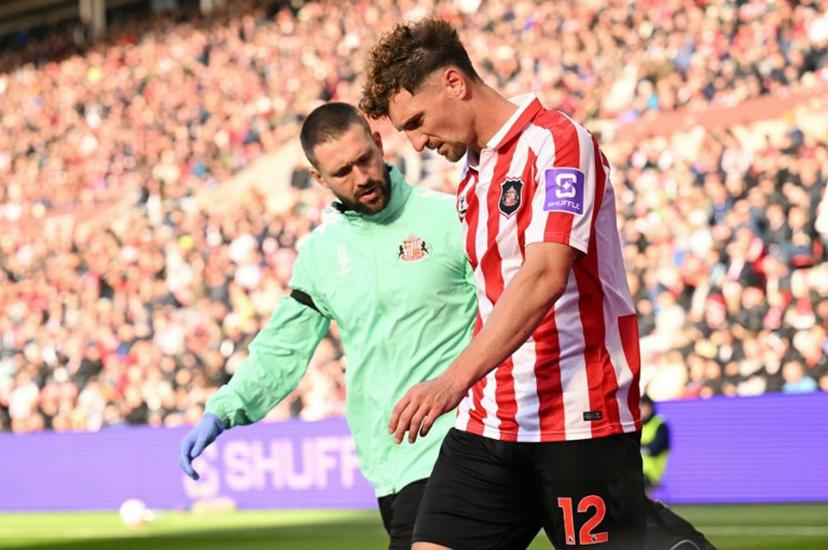 Sunderland's Belgian defender #12 Thomas Meunier leaves the pitch injured during the English Premier League football match between Sunderland and Brighton and Hove Albion at The Stadium of Light in Sunderland in north east England on October 10, 2026.  Oli SCARFF / AFP