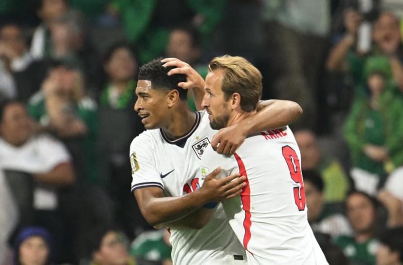 cEngland's midfielder #10 Jude Bellingham (L) celebrates scoring his team's first goal with teammate forward #09 Harry Kane (R) during the 2026 World Cup round of 16 football match between Mexico and England at the Mexico City Stadium in Mexico City on July 5, 2026.   Yuri CORTEZ / AFP