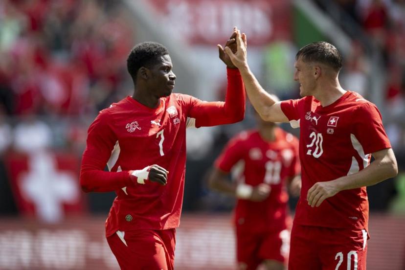 Switzerland's forward #7 Breel Embolo (L) celebrates with Switzerland's midfielder #20 Michel Aebischer scoring his team's first goal during a friendly football match between Switzerland and Jordan ahead of the 2026 FIFA World Cup football tournament at the Kybunpark stadium in St. Gallen on May 31, 2026.  Ennio LEANZA / AFP