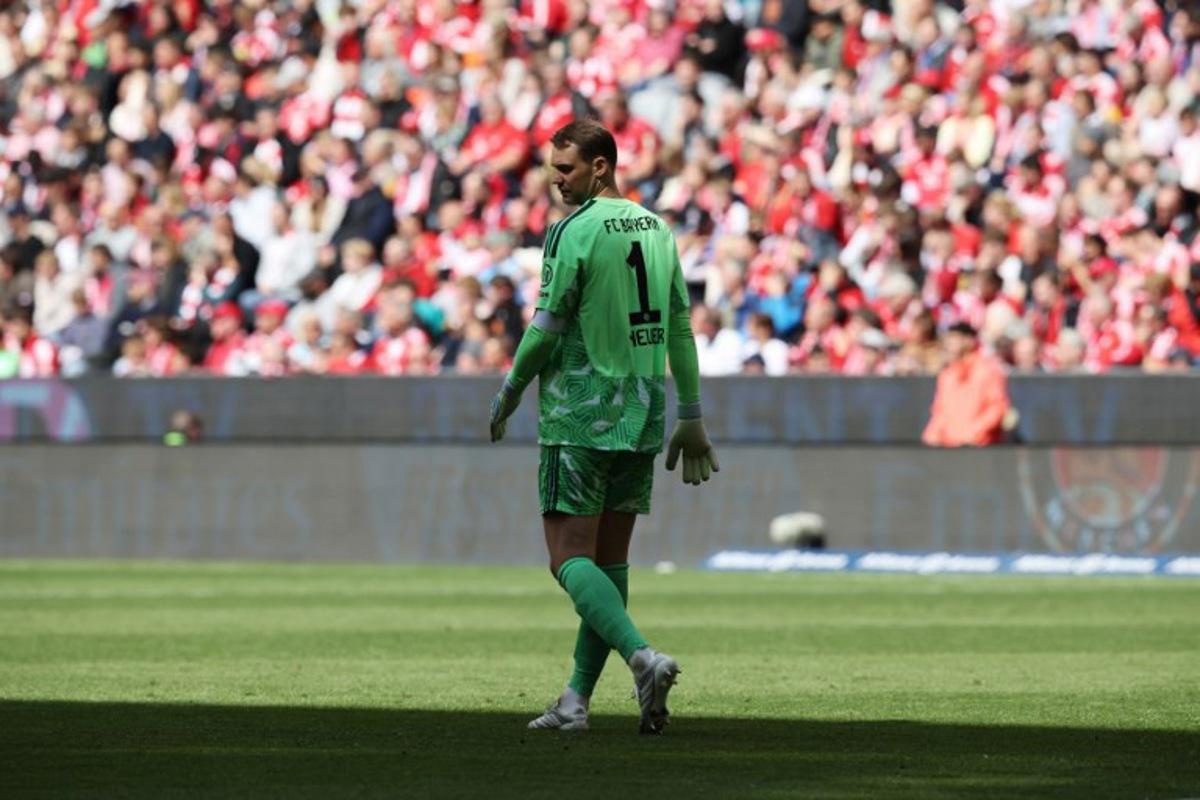 Bayern Munich's German goalkeeper #01 Manuel Neuer walks and looks down on the pitch during the German first division Bundesliga football match between FC Bayern Munich and FC Cologne in Munich, southern Germany, on May 16, 2026.  Alexandra BEIER / AFP