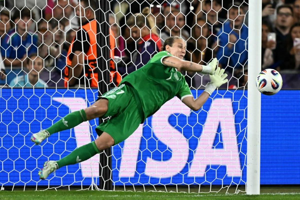 Germany's goalkeeper #01 Ann-Katrin Berger saves France's first penalty during a penalty shootout at the end of the extra time in the UEFA Women's Euro 2025 quarter finals football match between France and Germany at the Parc Saint-Jacques (St. Jakob Park) stadium in Basel, on July 19, 2025.  Fabrice COFFRINI / AFP