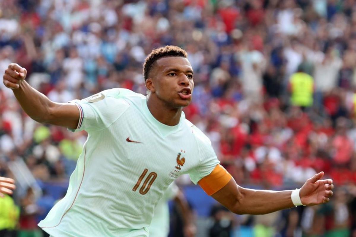 France's forward #10 Kylian Mbappe celebrates scoring his team's first goal during the 2026 World Cup football tournament quarter-final match between France and Morocco at Boston Stadium in Foxborough on July 9, 2026.   Odd ANDERSEN / AFP