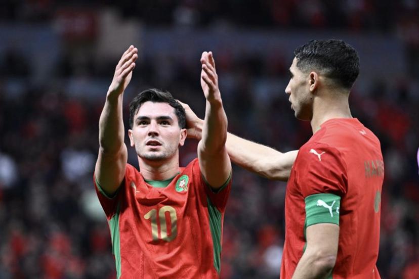 Morocco's forward #10 Brahim Diaz celebrates scoring his team's first goal next to Morocco's defender #02 Achraf Hakimi during the Africa Cup of Nations (CAN) round of 16 football match between Morocco and Tanzania at Prince Moulay Abdallah Stadium in Rabat on January 4, 2026.   SEBASTIEN BOZON / AFP