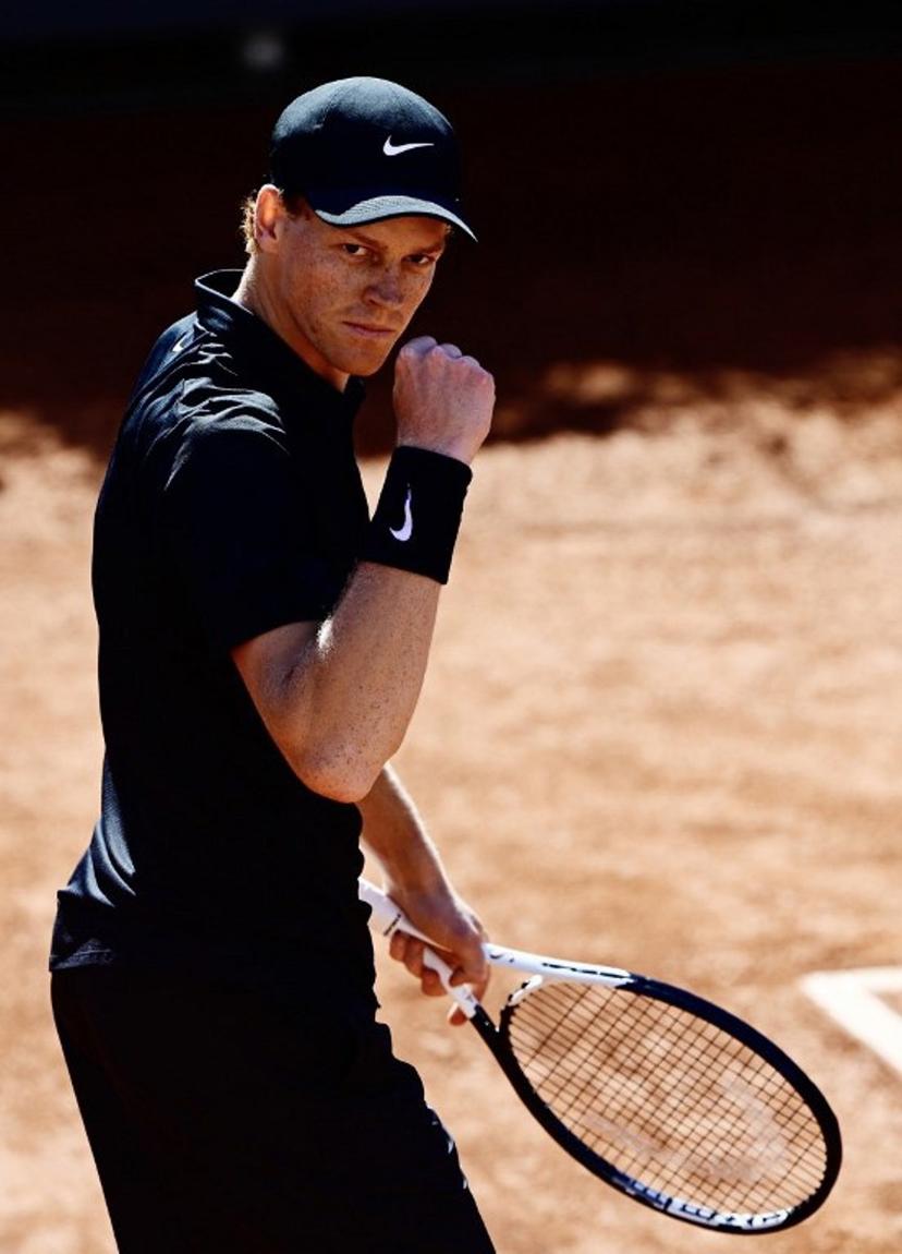 Italy's Jannik Sinner celebrates a point against Australia's Alexei Popyrin during the ATP Rome Open tennis tournament at Foro Italico in Rome on May 11, 2026.   Tiziana FABI / AFP