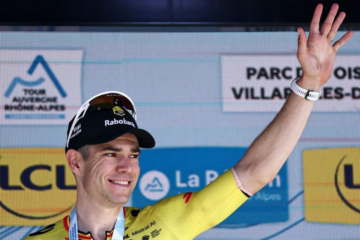 Stage winner Team Visma | Lease a Bike's Belgian rider Wout Van Aert celebrates on the podium of the 5th stage of the Tour Auvergne-Rhone-Alpes cycling race (formerly known as the Criterium du Dauphine), 195,8km between Saint-Chamond and Villars-les-Dombes, central France, on June 11, 2026.  Anne-Christine POUJOULAT / AFP