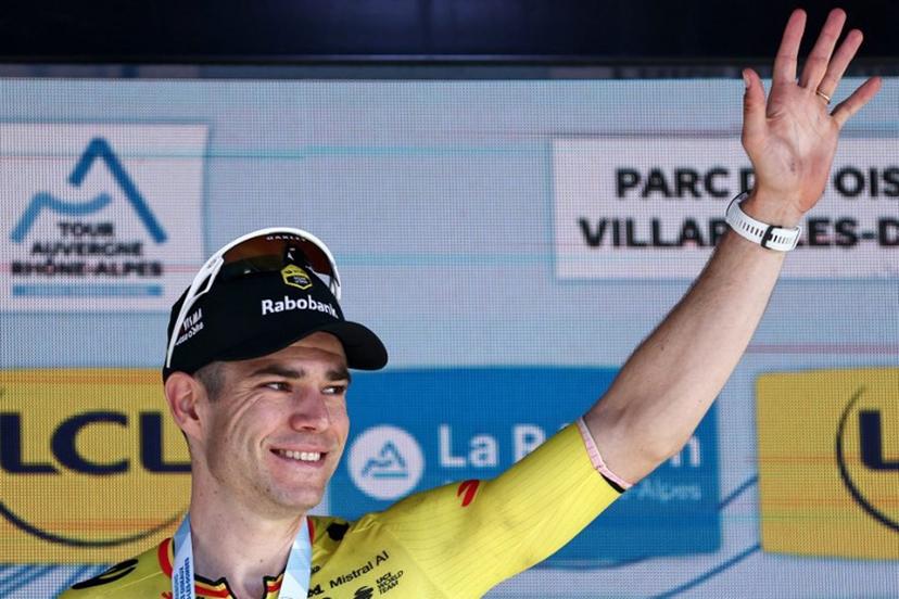Stage winner Team Visma | Lease a Bike's Belgian rider Wout Van Aert celebrates on the podium of the 5th stage of the Tour Auvergne-Rhone-Alpes cycling race (formerly known as the Criterium du Dauphine), 195,8km between Saint-Chamond and Villars-les-Dombes, central France, on June 11, 2026.  Anne-Christine POUJOULAT / AFP