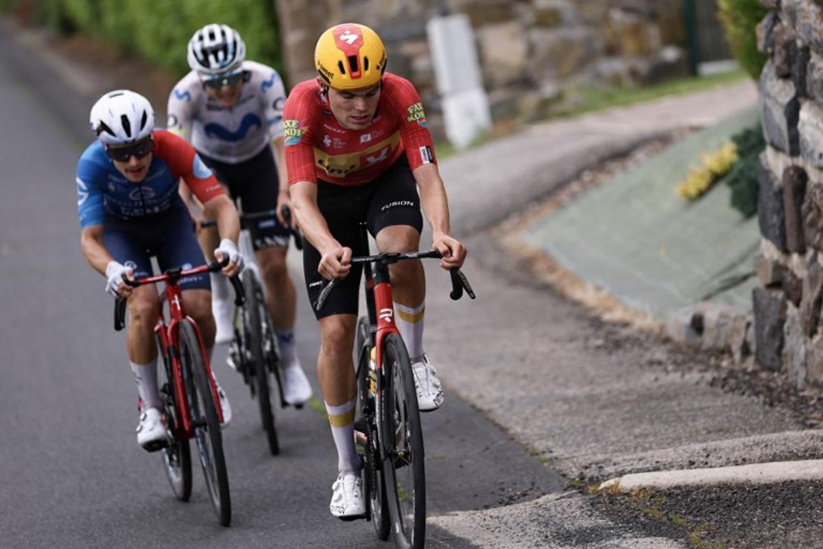 Uno-X Mobility's Danish rider Anthon Charmig leads a breakaway during the 2nd stage of the Tour Auvergne-Rhone-Alpes cycling race (formerly known as the Criterium du Dauphine), 234,3km between Saint-Martin-Le-Vinoux in the French Alps and Le Puy-en-Velay near the Massif Central, on June 8, 2026.  Anne-Christine POUJOULAT / AFP