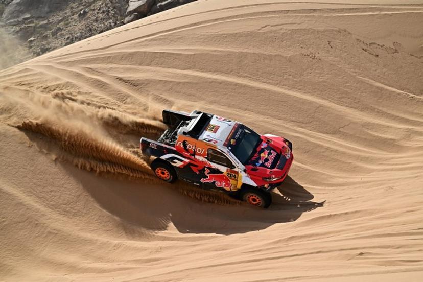 Toyota Gazoo Racing W2rc's Australian driver Toby Price and Spanish copilot Armand Monleon compete in Stage 12 of the 48th edition of the Dakar Rally 2026, between al-Henakiyah and Yanbu, Saudi Arabia, on January 16, 2026.  Giuseppe CACACE / AFP