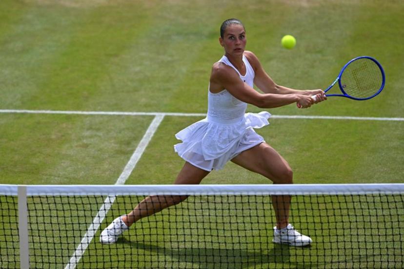 Ukraine's Marta Kostyuk returns to US player Ashlyn Krueger during their women's singles round of 16 tennis match on the eighth day of the 2026 Wimbledon Championships at The All England Lawn Tennis and Croquet Club in Wimbledon, southwest London, on July 6, 2026.  Glyn KIRK / AFP