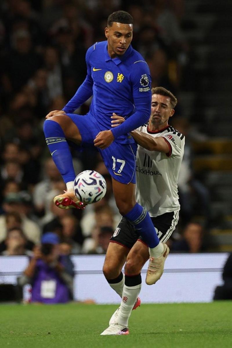 Chelsea's English midfielder #17 Morgan Rogers (L) vies with Fulham's Belgian defender #21 Timothy Castagne (R) during the English Premier League football match between Fulham and Chelsea at Craven Cottage in London on August 24, 2026.  Adrian Dennis / AFP