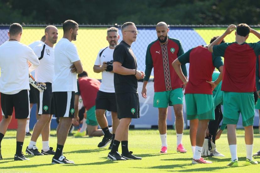 Morocco's head coach Mohamed Ouahbi (C) speaks to his players in an MD-1 training session at New England Revolution Training Centre in Foxborough, near Boston, on July 8, 2026, on the eve of the 2026 World Cup football tournament quarter-final match between France and Morocco.  Odd ANDERSEN / AFP