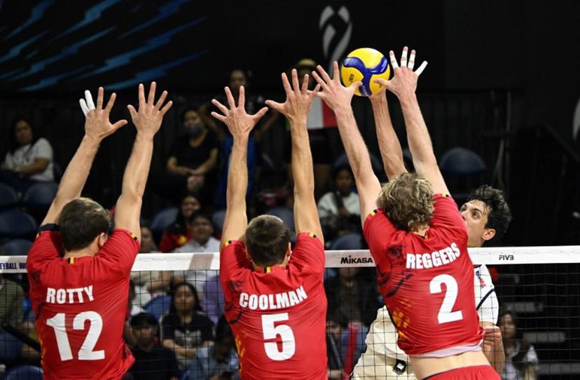 In this photo taken on April 16, 2025, Italy's Simone Anzani (R) spikes the ball against Belgium's Seppte Rotty (L), Pieter Coolman (C) and Ferre Reggers (R) at the World Men's Volleyball Championship in Manila.   Ted ALJIBE / AFP