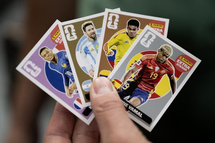 A worker shows collectible cards of (From L) France's forward Kylian Mbappé, Argentina's forward Lionel Messi, Colombia's forward Luis Diaz and Spain's forward Lamine Yamal for the upcoming 2026 FIFA World Cup hosted by the US, Canada and Mexico, at the Panini Group factory in Modena, northern Italy, on April 28, 2026.   MARCO BERTORELLO / AFP