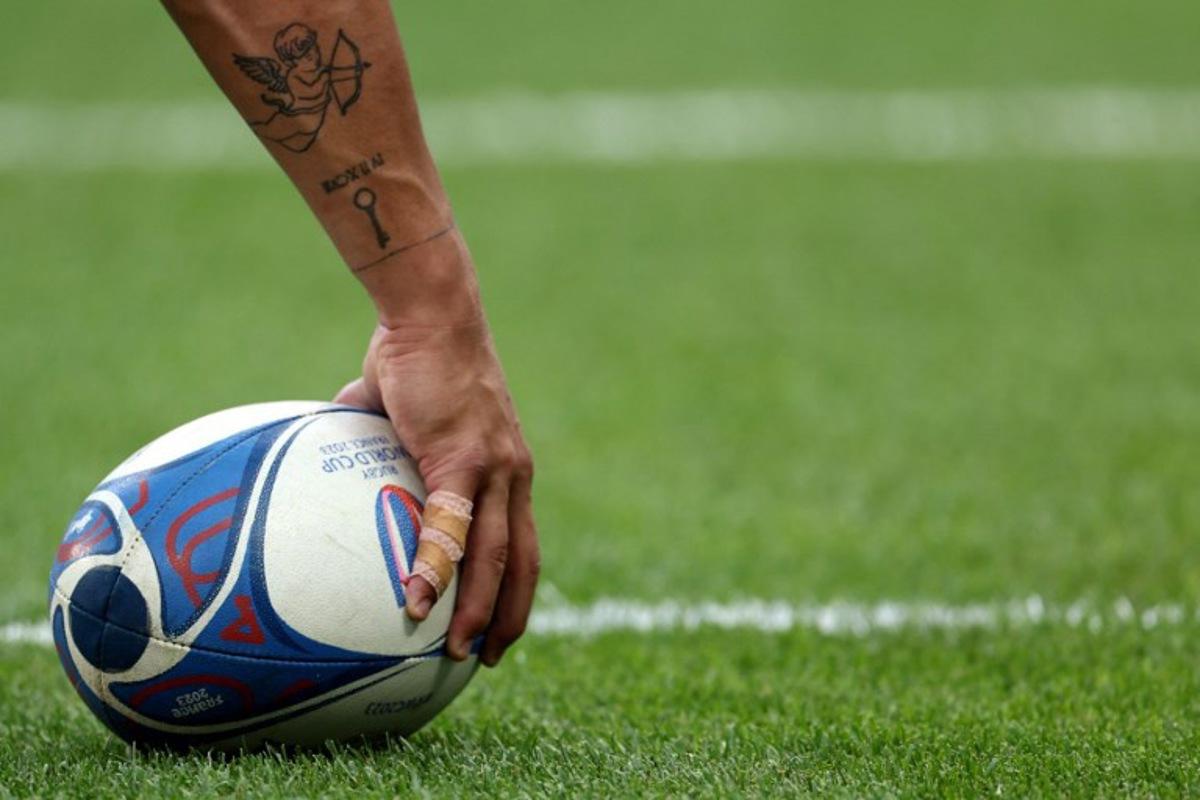 A player holds a ball prior to the  France 2023 Rugby World Cup Pool C match between Australia and Georgia at Stade de France in Saint-Denis, on the outskirts of Paris, on September 9, 2023.   FRANCK FIFE / AFP