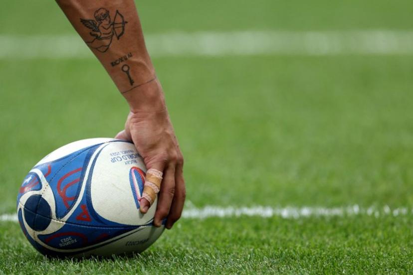 A player holds a ball prior to the  France 2023 Rugby World Cup Pool C match between Australia and Georgia at Stade de France in Saint-Denis, on the outskirts of Paris, on September 9, 2023.   FRANCK FIFE / AFP
