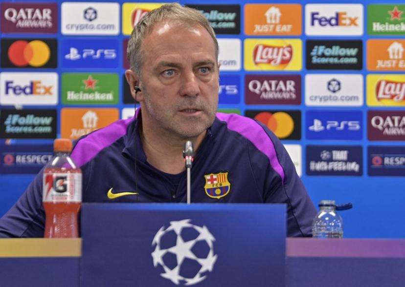 Barcelona's German coach Hans-Dieter Flick gives a press conference on the eve of their UEFA Champions League quarter final football match against Club Atletico de Madrid at the Joan Gamper training ground in Sant Joan Despi, near Barcelona, on April 7, 2026.  MANAURE QUINTERO / AFP
