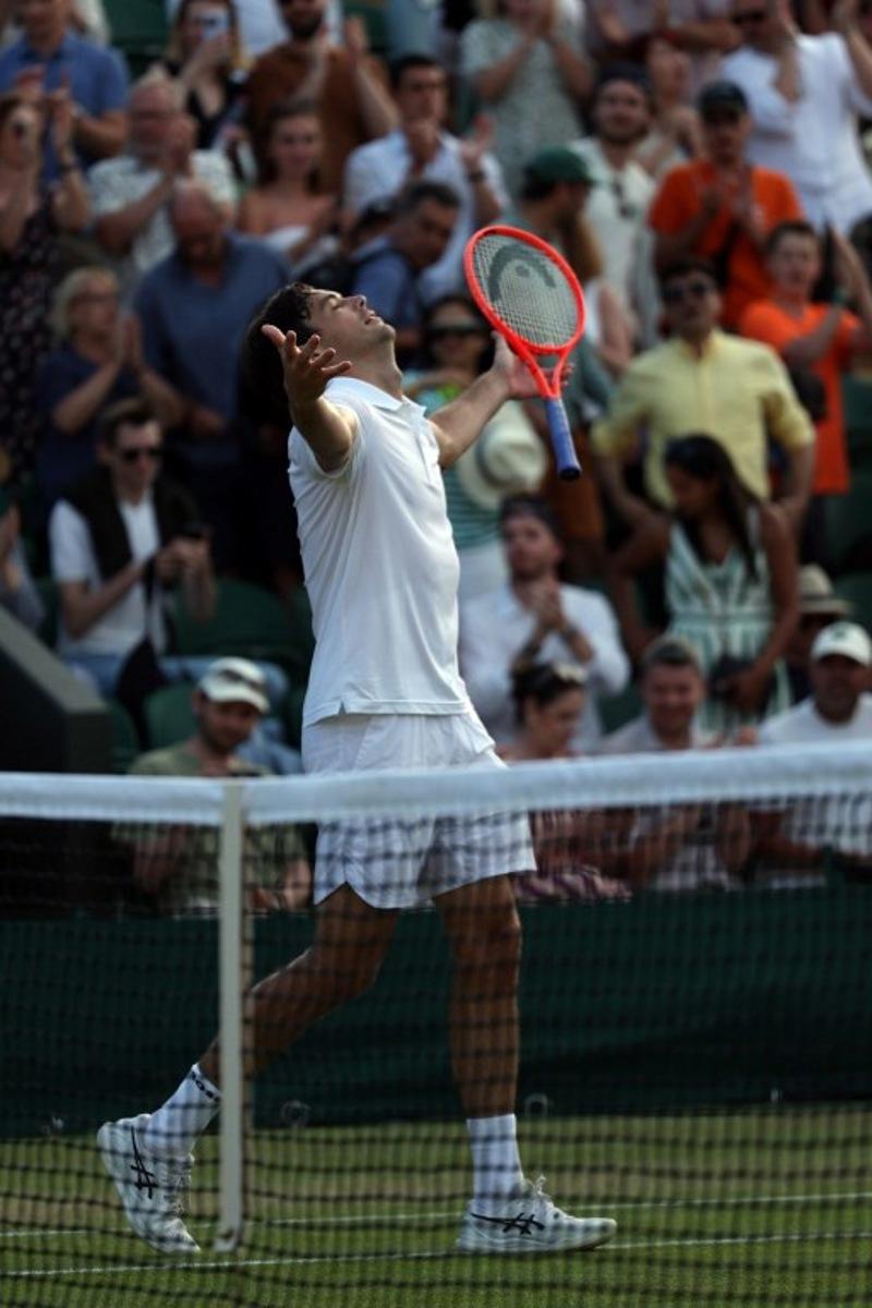 US player Taylor Fritz celebrates beating Italy's Lorenzo Sonego during their men's singles third round tennis match on the sixth day of the 2026 Wimbledon Championships at The All England Lawn Tennis and Croquet Club in Wimbledon, southwest London, on July 4, 2026.  Adrian Dennis / AFP