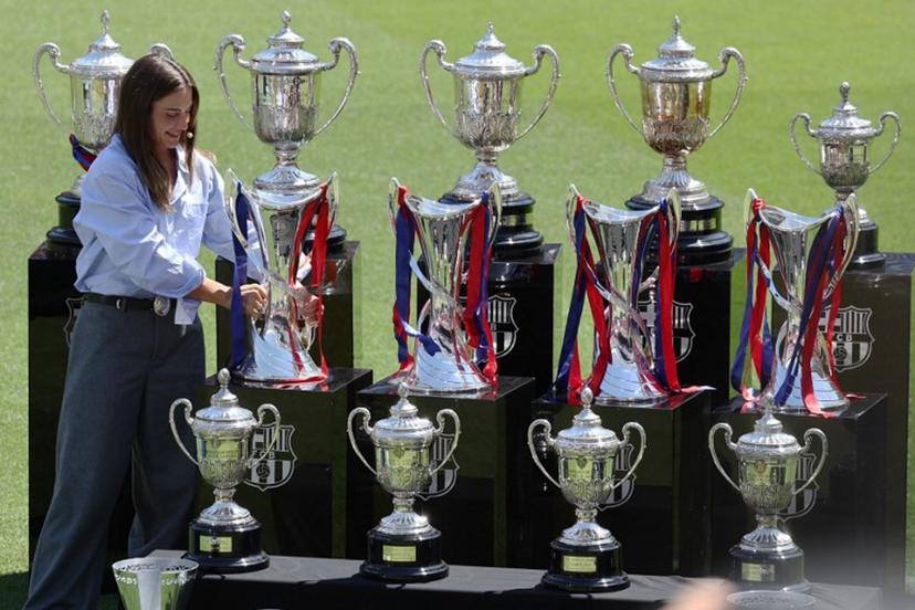 FC Barcelona captain Alexia Putellas takes her lastest Women's Champions League trophy during her farewell tribute ceremony at the Camp Nou stadium in Barcelona on May 27, 2026. Barcelona women's star Alexia Putellas will leave the Catalan giants at the end of her contract this summer bringing a "perfect story" to a close, she said yesterday. Josep LAGO / AFP