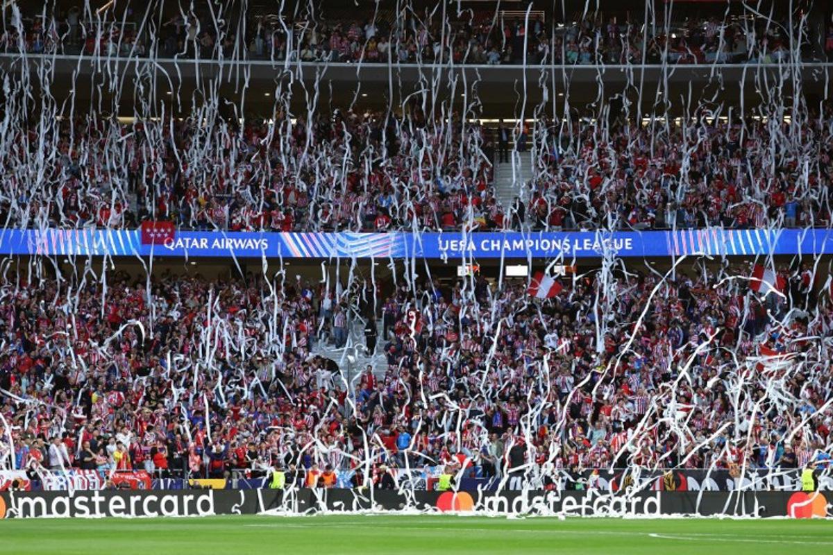 Atletico Madrid fans throw toilet paper before the UEFA Champions League semi-final first leg football match between Club Atletico de Madrid and Arsenal at the Metropolitano stadium in Madrid on April 29, 2026. Thomas COEX / AFP