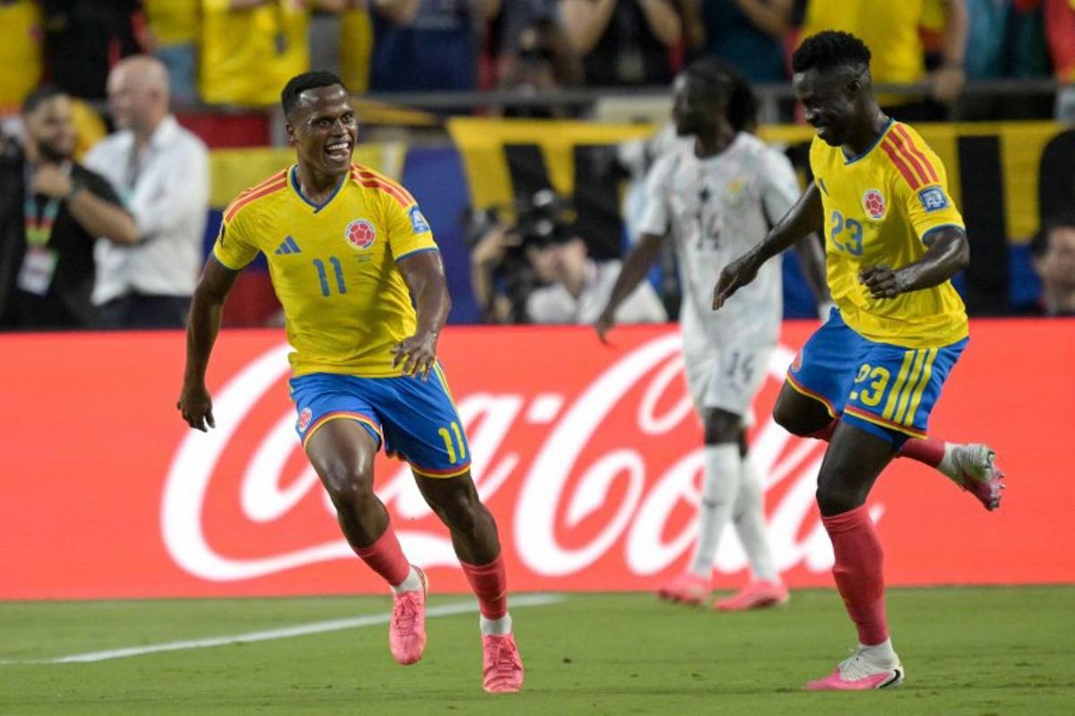 Colombia's midfielder #11 Jhon Arias (R) celebrates scoring his team's first goal with defender #23 Davinson Sanchez during the 2026 World Cup round of 32 football match between Colombia and Ghana at the Kansas City Stadium in Kansas City on July 3, 2026. JUAN MABROMATA / AFP