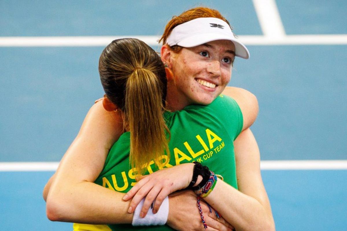 Australia's Maya Joint (R) celebrates with her team after victory against Colombia's Yuliana Monroy during their women's singles match at the Billie Jean King Cup in Brisbane on April 12, 2025. Patrick HAMILTON / AFP