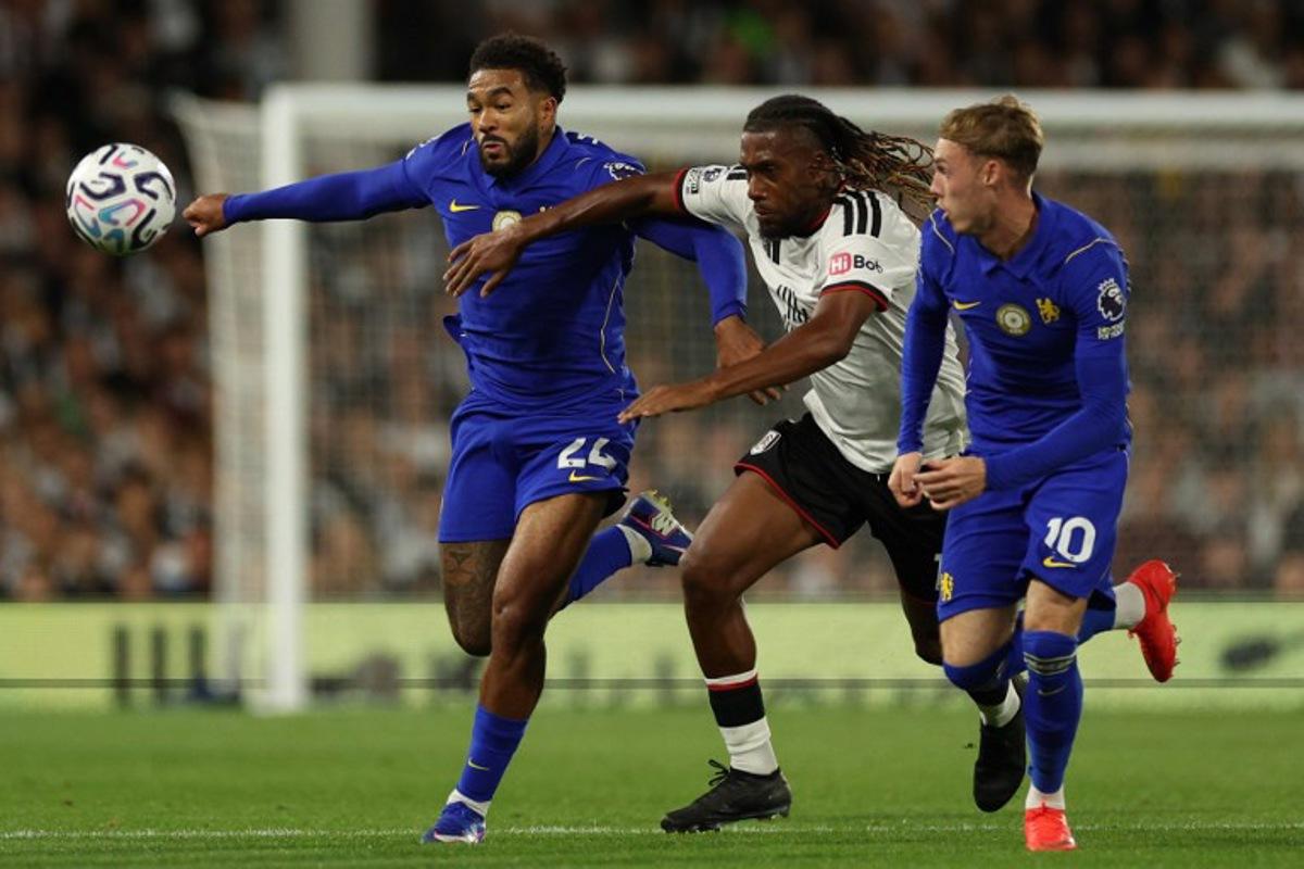 Chelsea's English defender #24 Reece James (L) vies with Fulham's Nigerian midfielder #17 Alex Iwobi (C) during the English Premier League football match between Fulham and Chelsea at Craven Cottage in London on August 24, 2026. Adrian Dennis / AFP