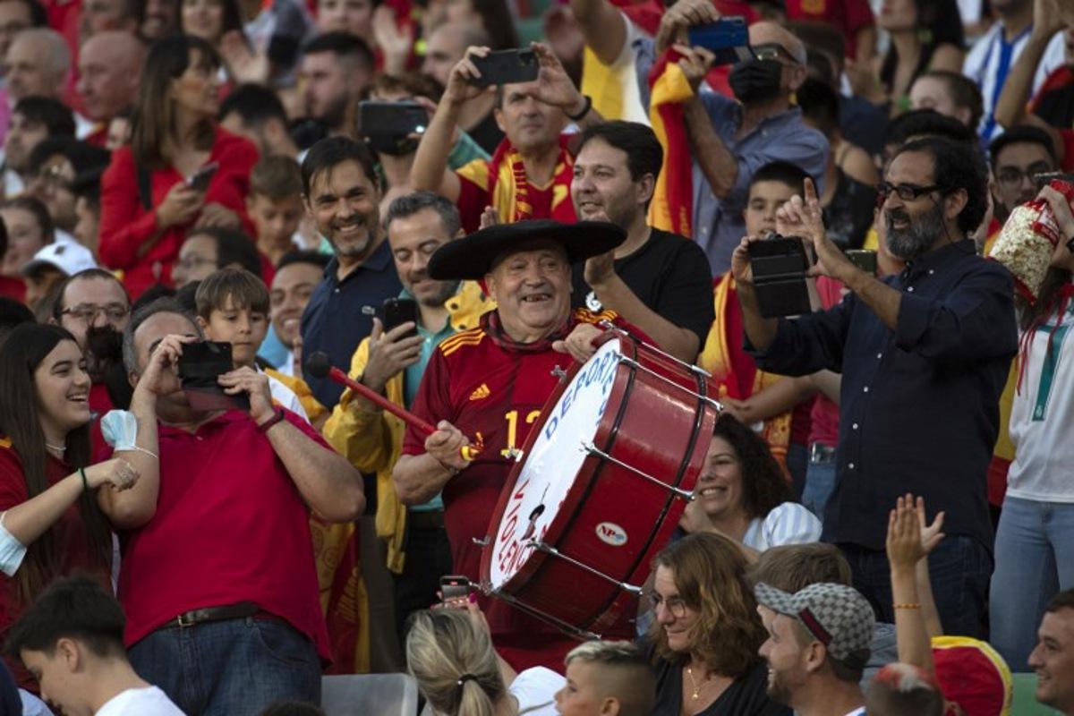 Well-known Spain fan Manuel Caceres Artesero, also known as "Manolo El del Bombo" (Manolo the Marching Bass Drummer), cheers on his team during the UEFA Nations League, league A group 2 football match between Spain and Portugal, at the Benito Villamarin stadium in Seville on June 2, 2022. JORGE GUERRERO / AFP