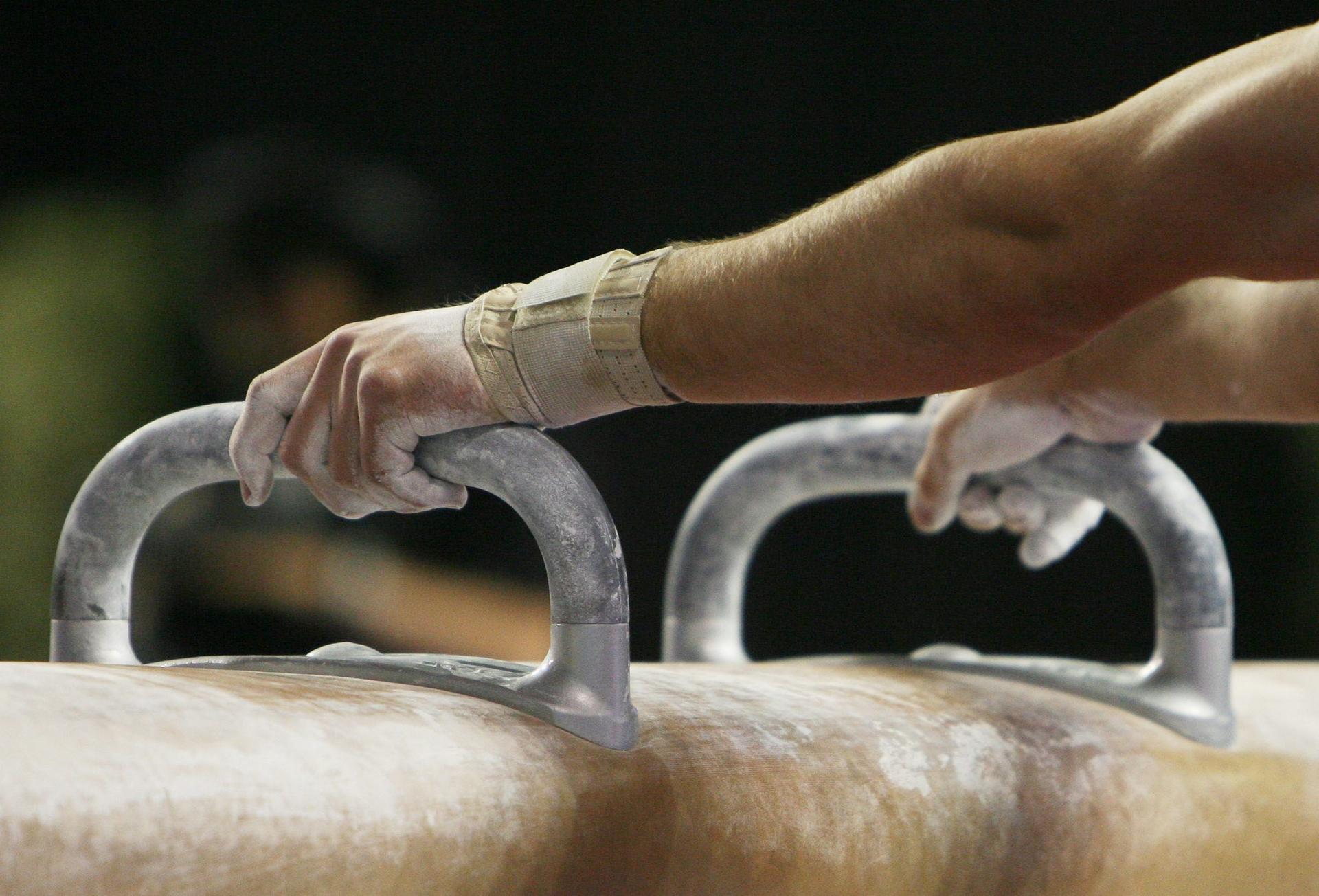 20070513 - GENT, BELGIUM : Illustration picture shows a close up on the hands of an athlete competing the vault men final of the World Cup Gymnastics at Gent's topsporthal, Sunday 13 June 2007, Belgium. BELGA PHOTO ERIC LALMAND