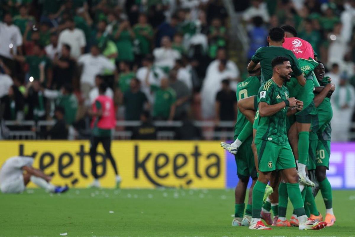 Saudi Arabia players celebrate after the FIFA World Cup 2026 Asian qualifier football match between Saudi Arabia and Iraq at King Abdullah Sports City in Jeddah on October 14, 2025. Abdel Ghani BASHIR / AFP