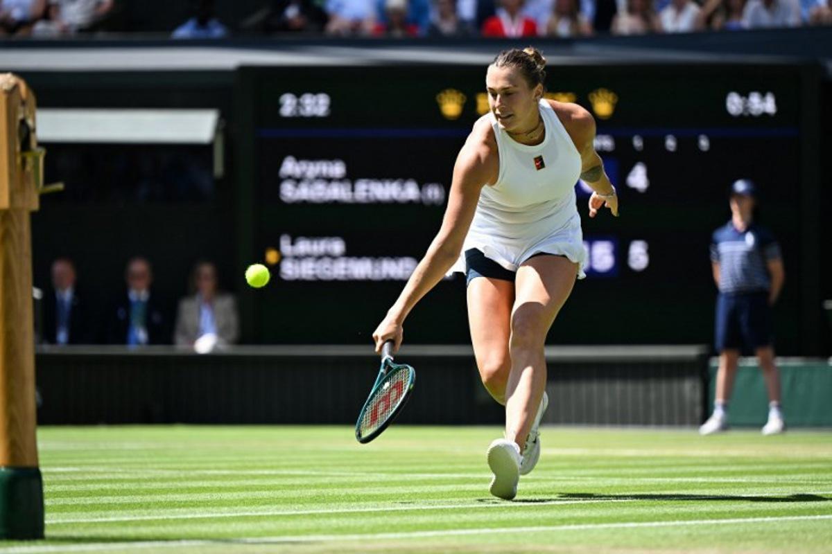 Belarus's Aryna Sabalenka returns the ball to Germany's Laura Siegemund during their women's singles quarter-final tennis match on the ninth day of the 2025 Wimbledon Championships at The All England Lawn Tennis and Croquet Club in Wimbledon, southwest London, on July 8, 2025. Kirill KUDRYAVTSEV / AFP
