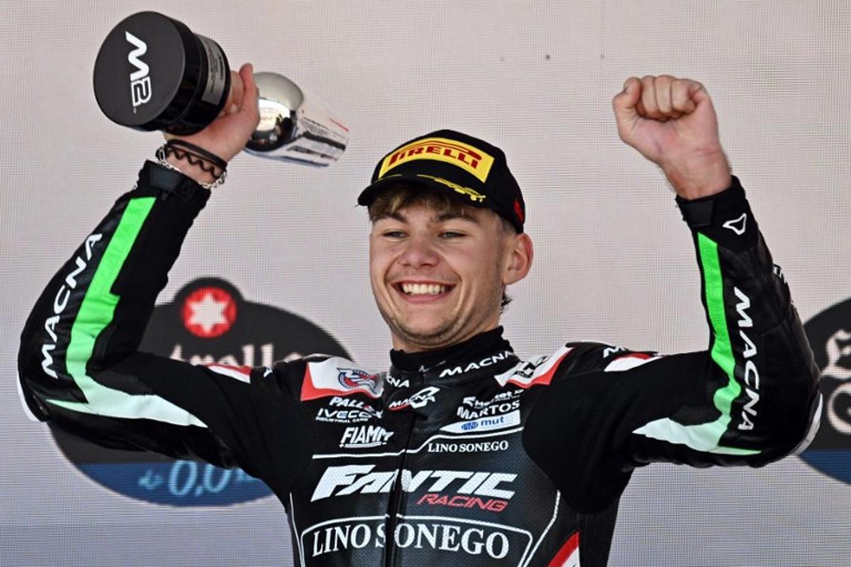 Second placed Fantic Racing's Belgian rider Barry Baltus celebrates on the podium after the Spanish Moto2 Grand Prix at the Jerez racetrack in Jerez de la Frontera, on April 27, 2025. JAVIER SORIANO / AFP