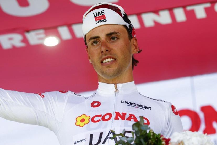 UAE Team Emirates - XRG Swiss rider Jan Christen wearing the best young rider's white jersey (Maglia Bianca) poses on the podium after the 4th stage of the Giro d'Italia 2026 - Tour of Italy cycling race between Catanzaro and Cosenza, Italy, on May 12, 2026. Luca Bettini / AFP