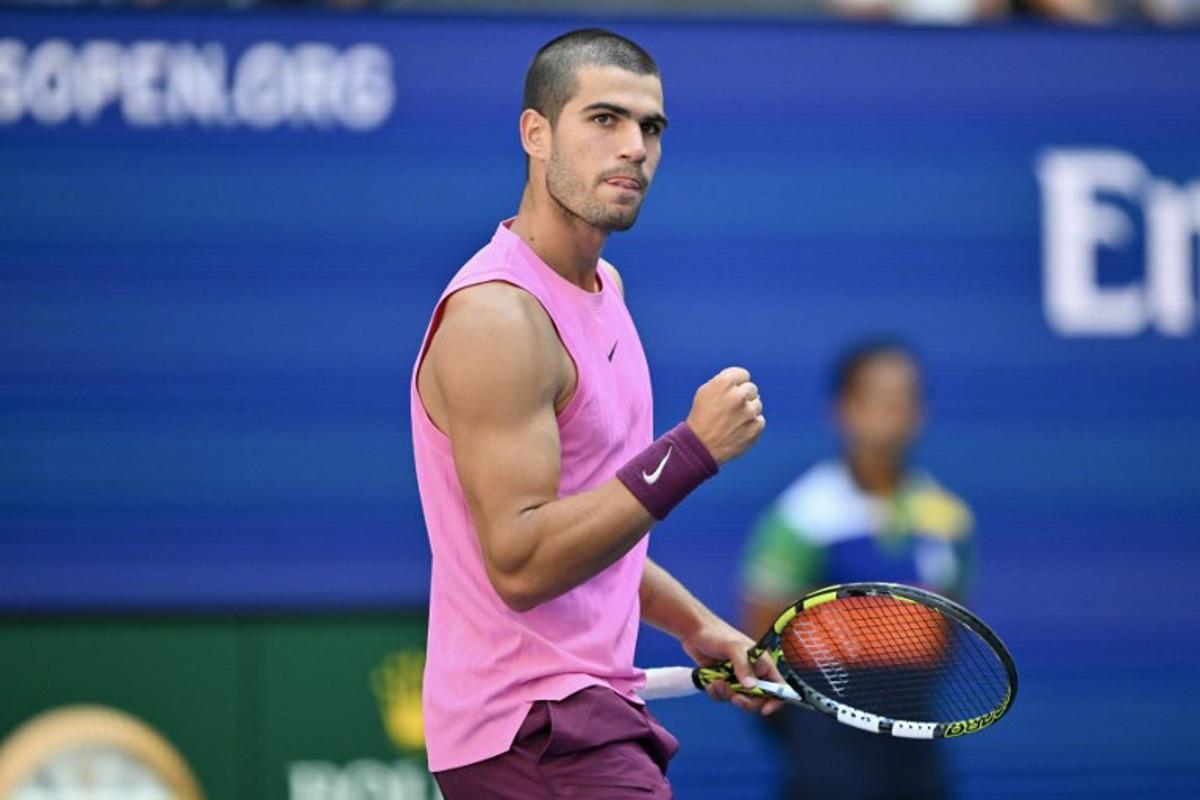 Spain's Carlos Alcaraz celebrates a point during his men's singles round of 16 tennis match against France's Arthur Rinderknech on day eight of the US Open tennis tournament at the USTA Billie Jean King National Tennis Center in New York City, on August 31, 2025. ANGELA WEISS / AFP