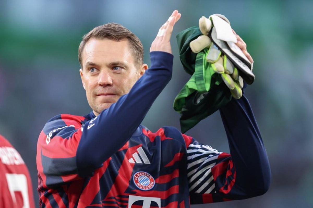 Bayern Munich's German goalkeeper #01 Manuel Neuer applauds the fans after the German first division Bundesliga football match between VfL Wolfsburg and FC Bayern Munich in Wolfsburg, on May 9, 2026. Ronny HARTMANN / AFP