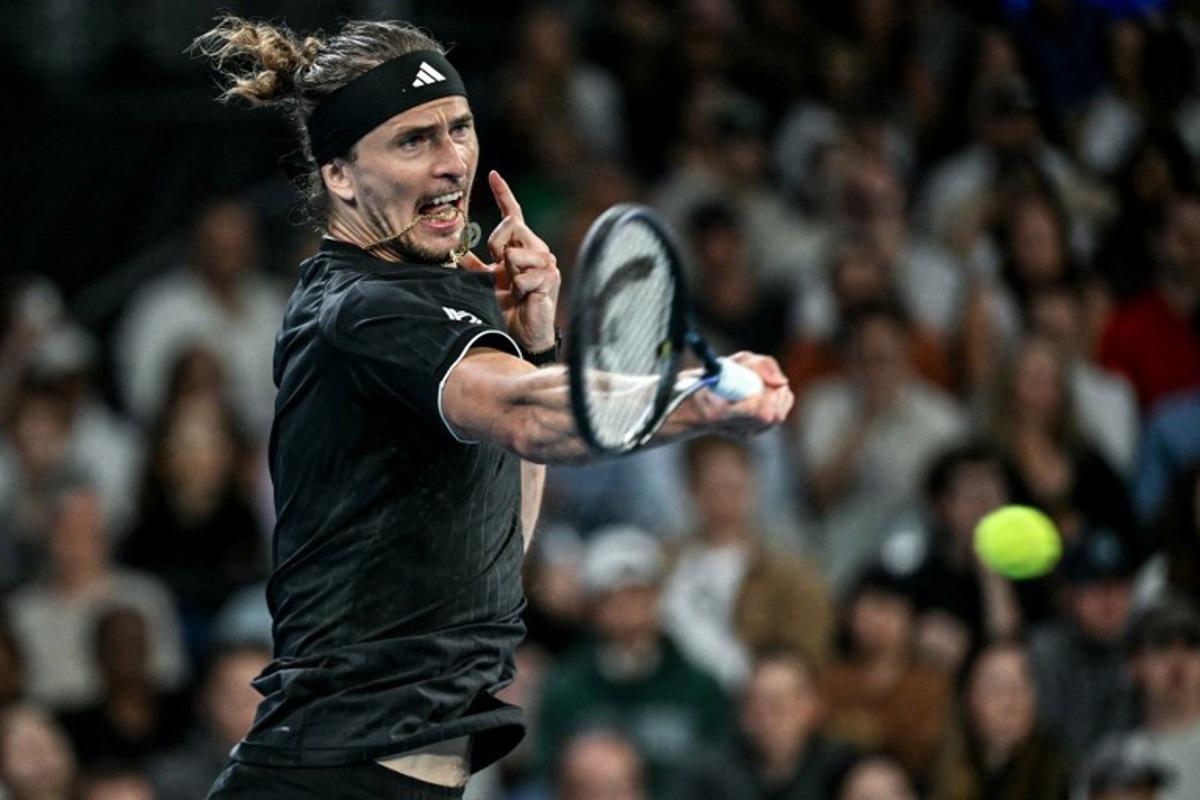 Germany's Alexander Zverev hits a return to France's Alexandre Muller during their men's singles match on day four of the Australian Open tennis tournament in Melbourne on January 21, 2026. Paul Crock / AFP
