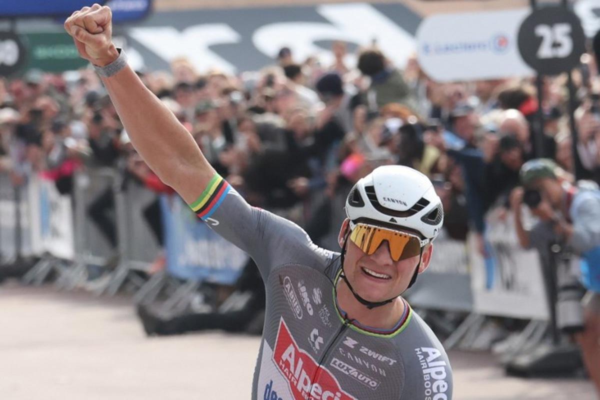 Alpecin-Deceuninck's Dutch rider Mathieu van der Poel celebrates after crossing the finish line to win the 122nd edition of the Paris-Roubaix one-day classic cycling race, 259,2 km between Compiegne and Roubaix, at the Vélodrome André-Pétrieux in Roubaix, northern France on April 13, 2025. Francois LO PRESTI / AFP