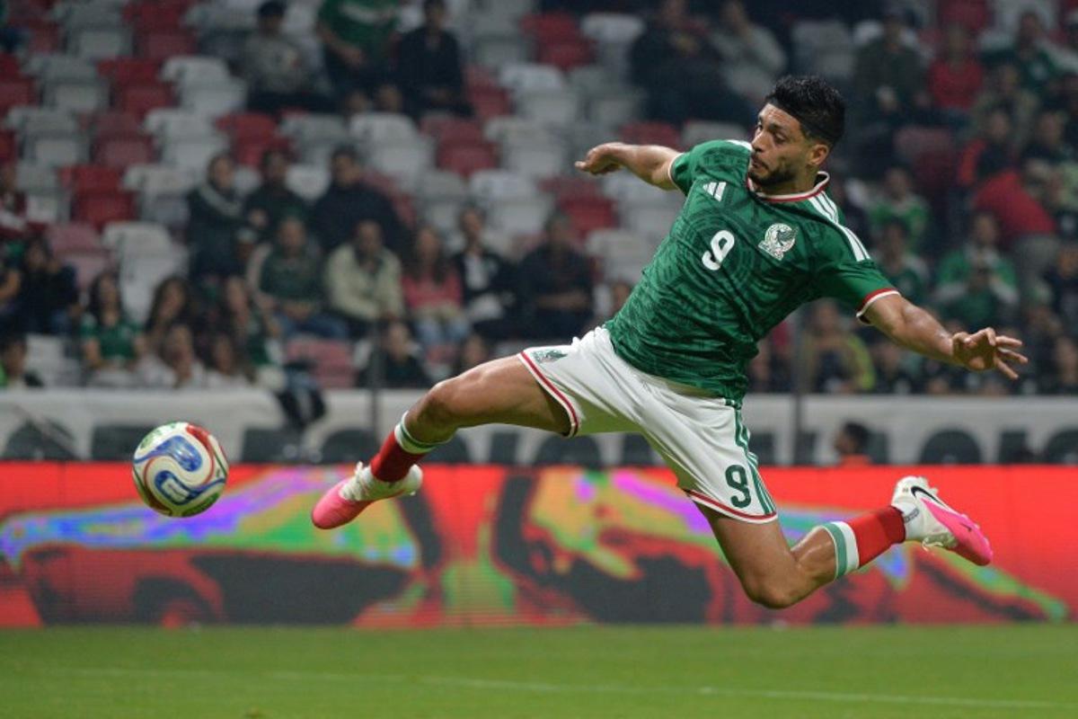 Mexico's forward #09 Raul Jimenez jumps for the ball during the international friendly football match between Mexico and Serbia at the Nemesio Diez Stadium in Toluca, Mexico on June 4, 2026. Mario Vazquez / AFP