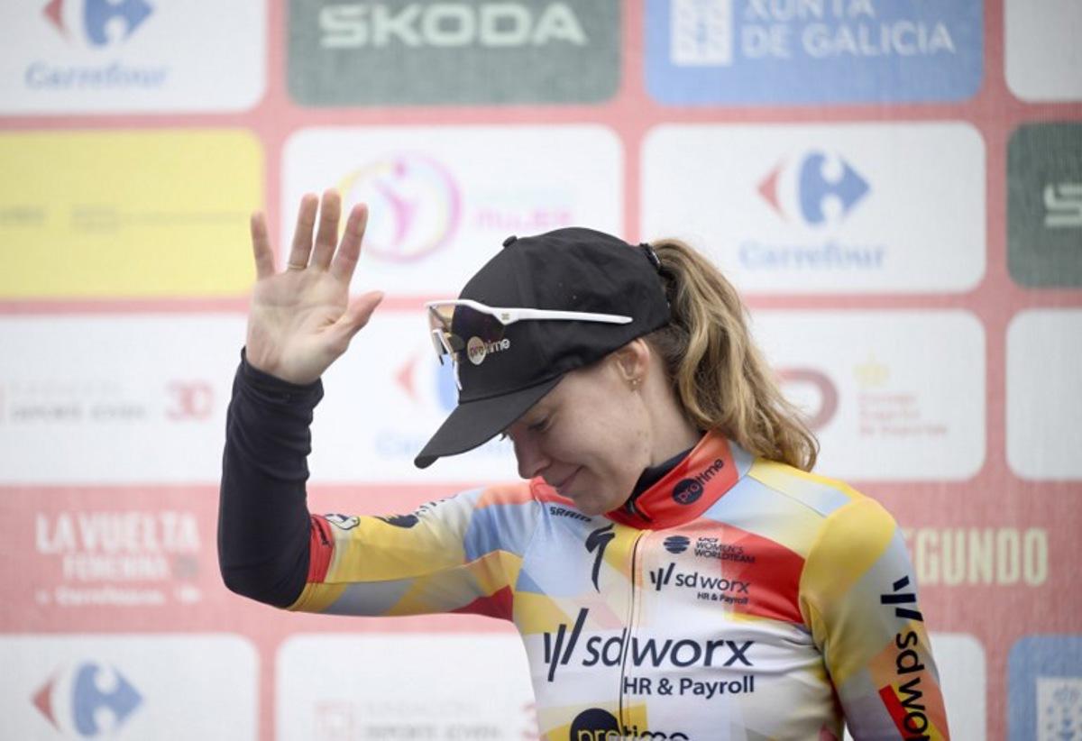 Stage winner and overall leader Team SD Worx - Protime's Dutch rider Anna van der Breggen celebrates on the podium of the 6th stage of the 2026 La Vuelta Femenina cycling tour of Spain, a 106.5 km race between Gijon and Les Praeres, on May 8, 2026. Miguel RIOPA / AFP