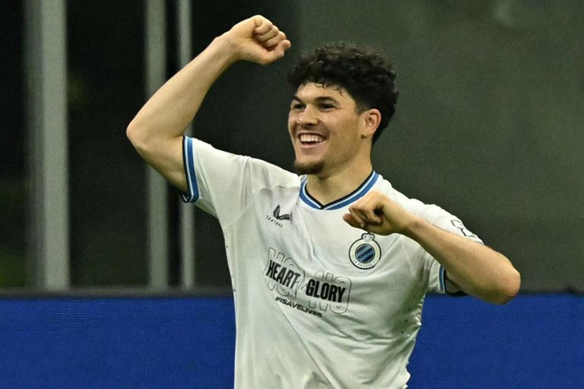 Club Brugge's Belgian defender #64 Kyriani Sabbe celebrates scoring his team's first goal during the Champions League football match between AC Milan and Club Brugge at the San Siro stadium in Milan on October 22, 2024. Gabriel BOUYS / AFP