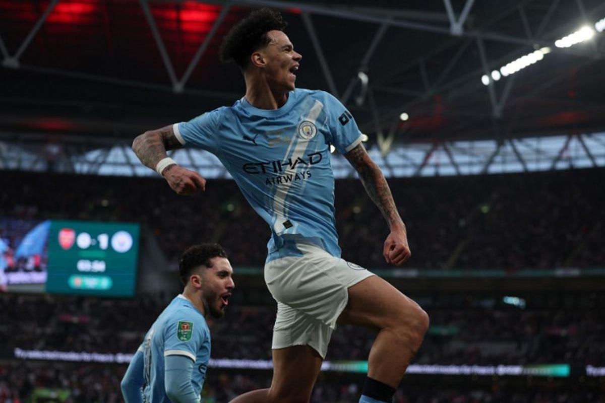 Manchester City's English midfielder #33 Nico O'Reilly celebrates scoring their second goal during the English League Cup final football match between Arsenal and Manchester City at Wembley Stadium in London on March 22, 2026. Adrian Dennis / AFP