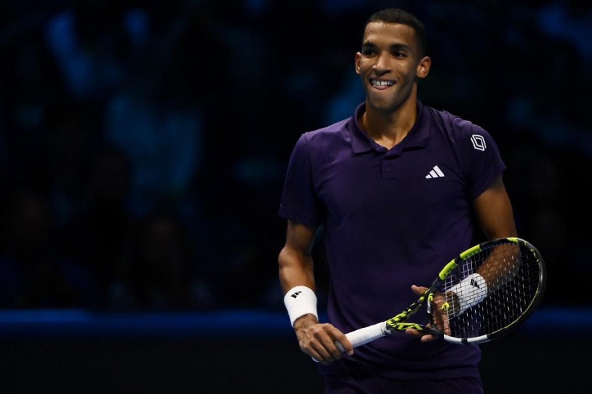 Canada's Felix Auger Aliassime reacts as he plays against Germany's Alexander Zverev during their men's single tennis match at the ATP Finals tennis tournament, in Turin, on November 14, 2025. MARCO BERTORELLO / AFP