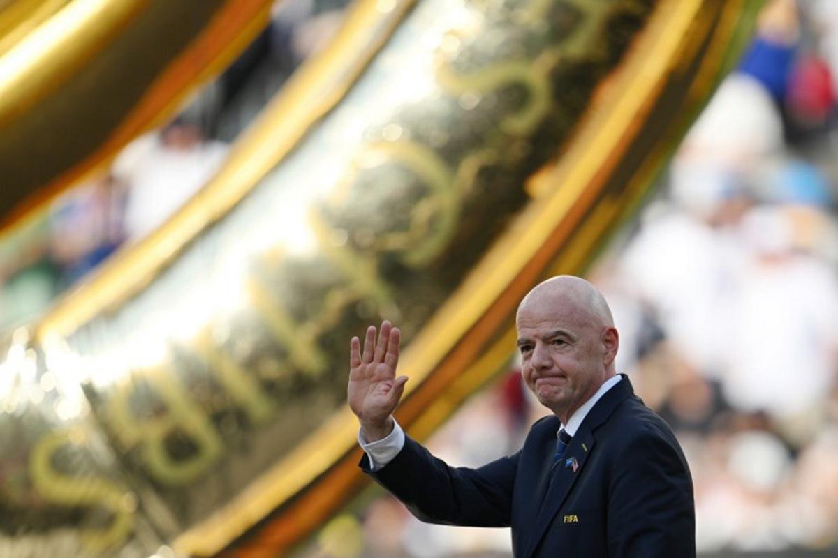 FIFA President Gianni Infantino waves during the award ceremony for the FIFA Club World Cup 2025 Champions, following the final football match between England's Chelsea and France's Paris Saint-Germain at the MetLife Stadium in East Rutherford, New Jersey on July 13, 2025. ANGELA WEISS / AFP