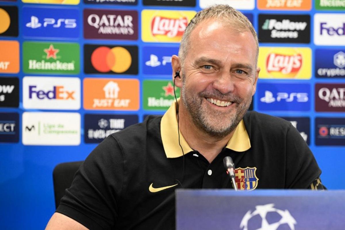 Barcelona's German coach Hans-Dieter Flick gives a press conference on the eve of the UEFA Champions League quarter final first leg football match between Barcelona and Borussia Dortmund at the Joan Gamper training ground in Sant Joan Despi, near Barcelona, on April 8, 2025. Josep LAGO / AFP