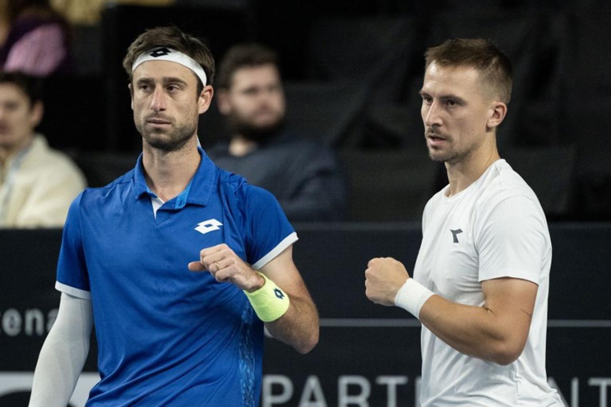 Belgium's Sander Gille (L) and Poland's Jan Zielinski (R) react during their men's doubles final tennis match against France's Benjamin Bonzi and France's Pierre-Hughes Herbert at the Marseille Open 13 ATP World Tour in Marseille, southern France on February 16, 2025. MIGUEL MEDINA / AFP