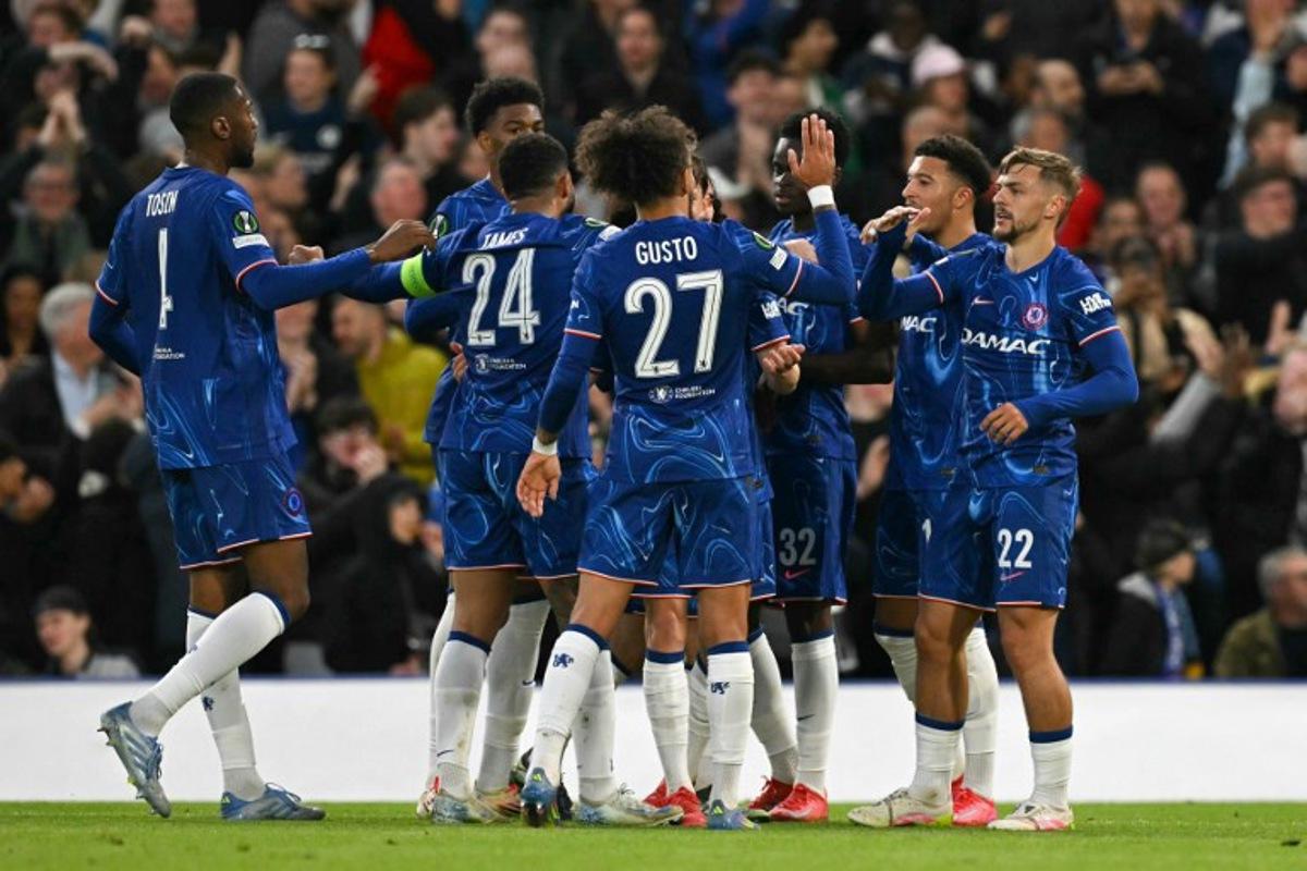 Chelsea's English midfielder #22 Kiernan Dewsbury-Hall (R) celebrates scoring his team's first goal with team mates during the UEFA Conference League semi-final second leg football match between Chelsea FC and Djurgardens IF at Stamford Bridge in London on May 8, 2025. Glyn KIRK / AFP