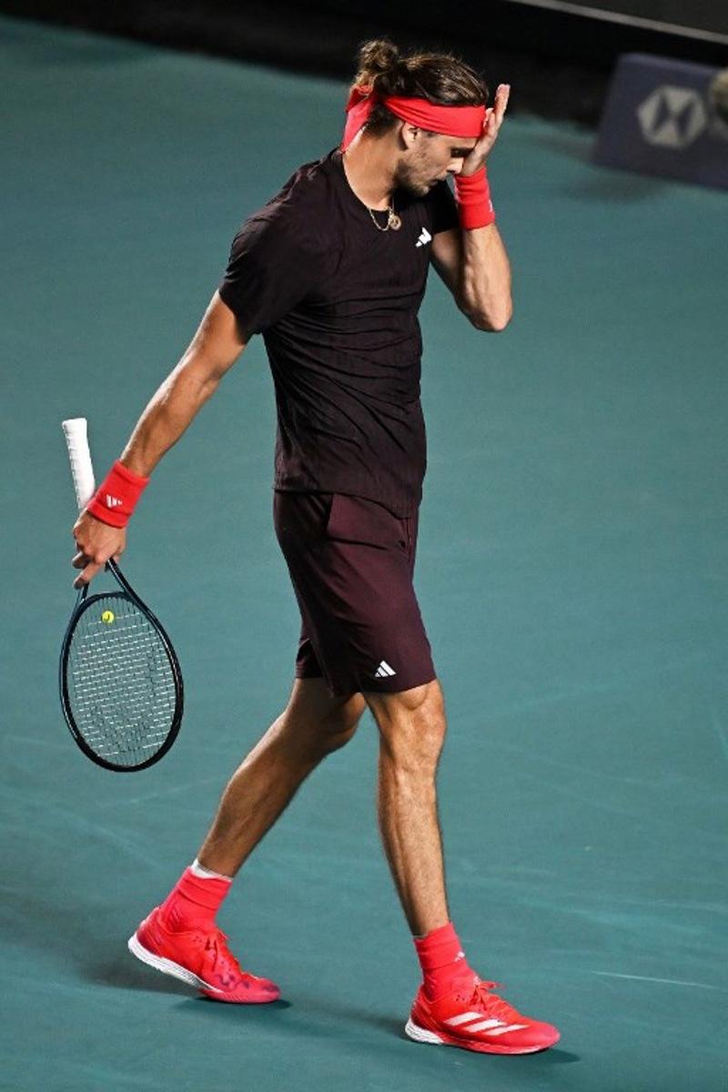 Germany's Alexander Zverev reacts after losing a point against USA's Lerner Tien during their 2025 Mexico ATP Open 500 men´s singles tennis match at the Arena GNP Seguros in Acapulco, Guerrero State, Mexico on February 26, 2025. CARL DE SOUZA / AFP