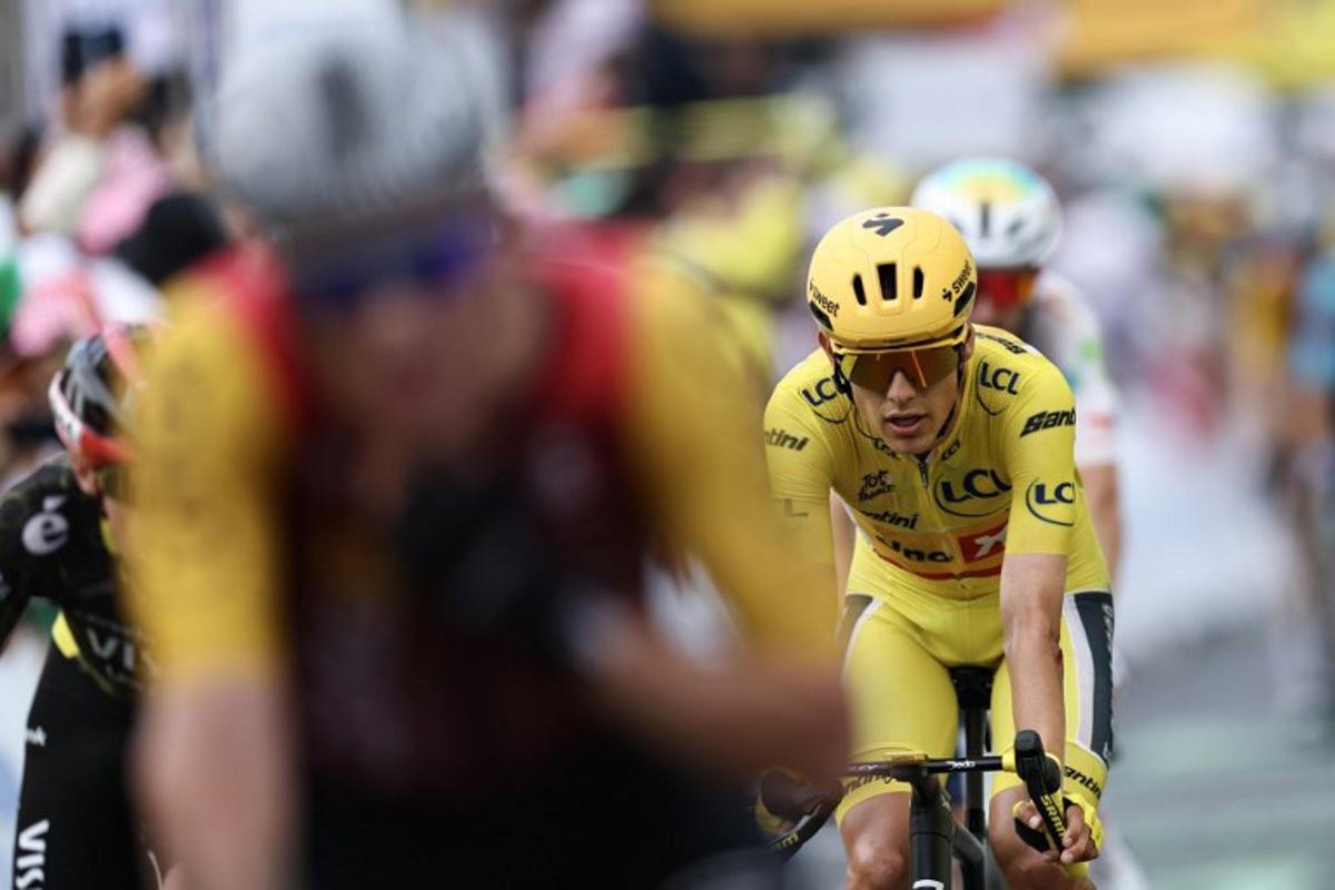 Uno-X Mobility team's Norwegian rider Torstein Traeen wearing the overall leader's yellow jersey crosses the finish line of the 5th stage of the 113th edition of the Tour de France cycling race, 158 km between Lannemezan and Pau in southwestern France, on July 8, 2026. Anne-Christine POUJOULAT / AFP