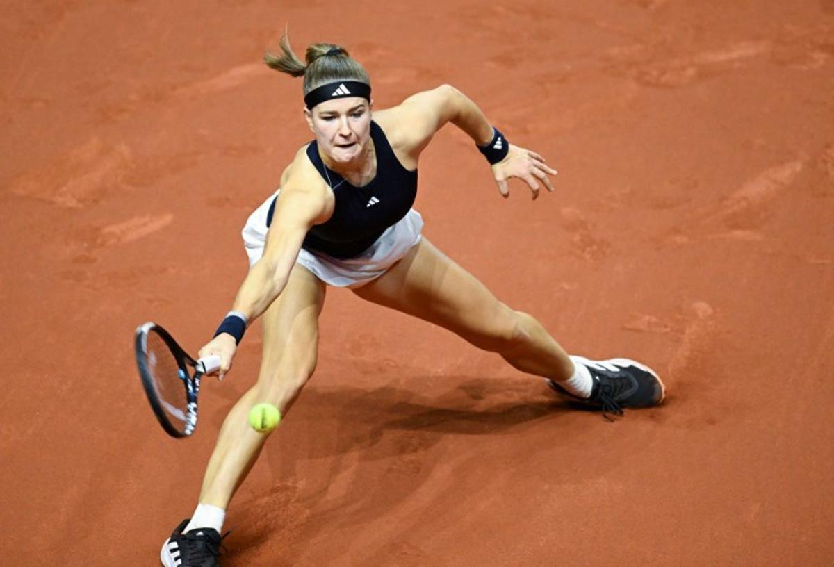 Czech Republic's Karolina Muchova returns the ball to Ukraine's Elina Svitolina (unseen) during their semi-final match of the 2026 WTA Stuttgart Open Tennis Tournament on April 18, 2026 in Stuttgart, south-western Germany. THOMAS KIENZLE / AFP